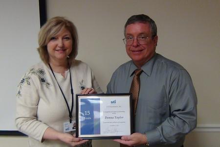 David Raby recognizes Donna Taylor’s 15-year milestone
